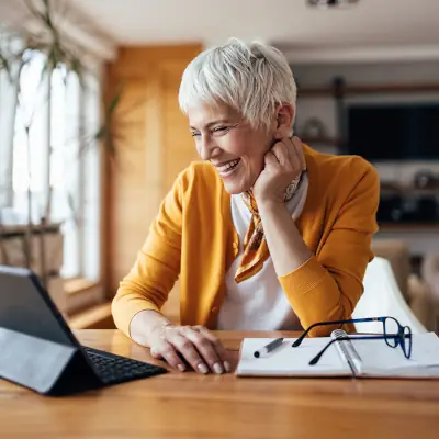 Image of woman looking at laptop